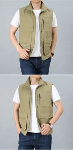 Close-up of khaki multi-pocket vest showing zip closure and functional outdoor pockets