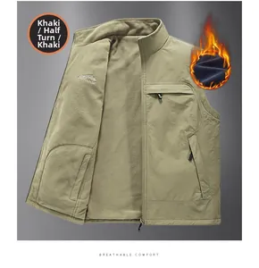 Detailed view of khaki reversible fleece vest with standing collar and outdoor embroidery