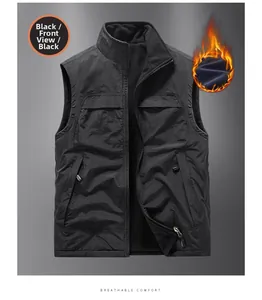 Detail view of the reversible black vest showing its windproof fabric and warm fleece lining