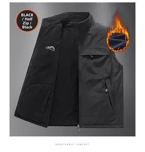 Detail of black reversible outdoor vest showing stand collar and fleece lining texture