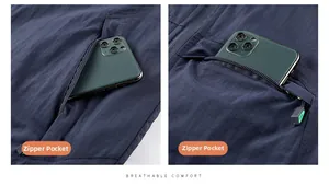 Detail view of zippered pocket on navy outdoor vest showing phone capacity and fabric texture