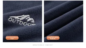 Detail of outdoor fleece vest featuring mountain embroidery and breathable fabric texture