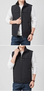Close-up of quick-dry fishing vest with stand collar, zipper pockets, and green puller