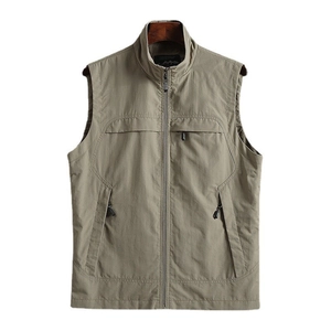 Detail of khaki outdoor utility vest featuring stand collar and smooth zipper pockets