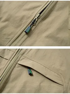 Detail of khaki outdoor vest showing smooth zipper puller and reinforced chest pocket