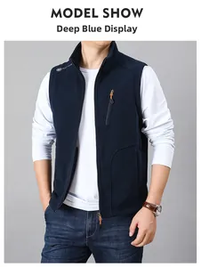 Detail of dark blue fleece vest featuring a stand collar and vertical zipper pocket