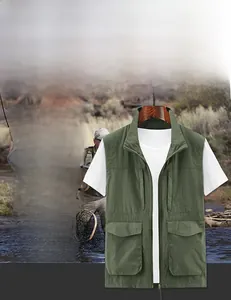 Detail of dark green outdoor vest featuring stand collar and functional utility pockets