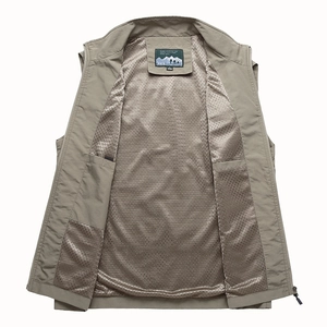Detail view of khaki outdoor vest showing breathable mesh lining and inner pockets