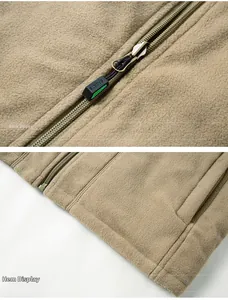 Detail view of khaki fleece vest showing reverse zipper and precision hem stitching