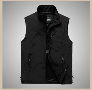 Detail of black outdoor vest showing breathable mesh lining and secure zipper pocket
