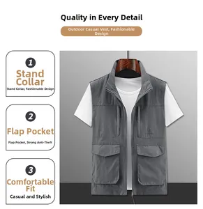 Detail of grey outdoor vest featuring a stand-up collar and four large functional utility pockets