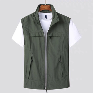 Men's outdoor utility cargo vest in dark green with zip pockets on a wooden hanger