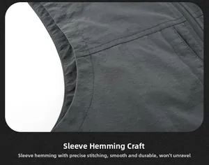 Close-up of the smooth cuff stitching and high-quality seam detail on a grey outdoor vest