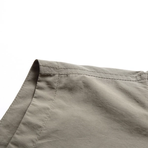 Close-up of high-density cotton fabric with precision double-needle stitching detail