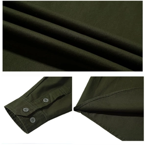 Detail view of military green cotton cargo shirt fabric, buttoned cuffs and curved hem