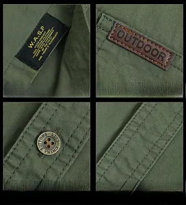 Dettagli della camicia outdoor verde militare con bottoni in metallo e patch in pelle