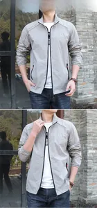 Vue extérieure d'une veste de protection solaire grise légère pour hommes avec capuche