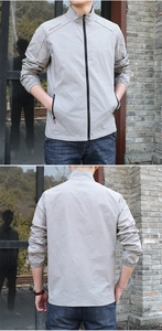 Détail d'une veste de protection solaire gris clair pour homme avec poches zippées