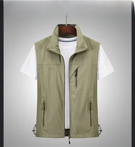 Macro shot of khaki outdoor vest showing quick-dry fabric texture and pocket detail