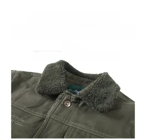 Detail of army green jacket featuring plush fleece collar and branded button accents