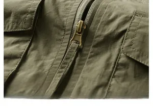 Detail of army green outdoor vest showing durable metal zipper and pocket stitching