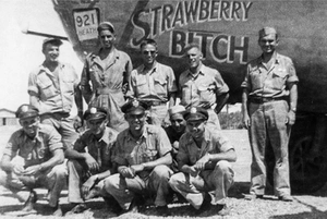 Close-up of vintage B-24 bomber nose art featuring Strawberry Bitch historical crew