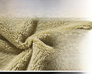 Macro shot of thick warm fleece lining for men's winter denim jacket material