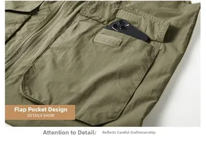 Close-up of olive tactical vest showing flap pocket with velcro and durable fabric texture