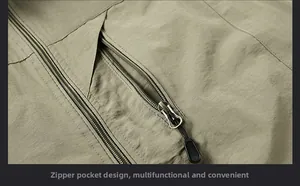 Close-up of durable olive green outdoor vest featuring functional zipper pocket detail