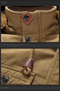 Detail of cotton parka showing high collar with faux fur lining and leather adjusters