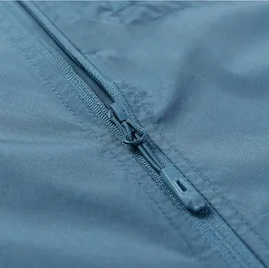 Close-up of durable zipper detail and breathable fabric texture on blue sun protection jacket