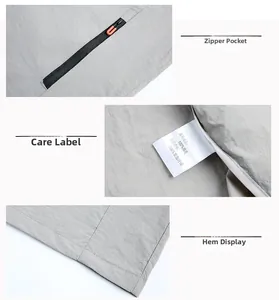 Détails de la texture du tissu 100% nylon et poche zippée fonctionnelle sur cette veste