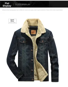 Detailed close-up of dark blue denim jacket featuring thick beige sherpa fleece lining