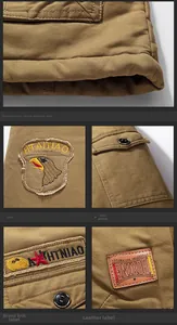 Detailed close-up of men's khaki cotton jacket with windproof hem and embroidered patch