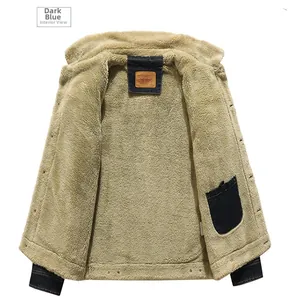 Detailed view of dark blue denim jacket with thick beige sherpa lining and inner pocket
