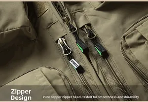 Detail of khaki outdoor vest showing multi-pocket structure and durable brass zippers