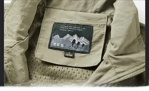 Close-up of neckline stitching and breathable mesh lining on army green vest