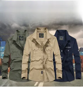 Close-up of long sleeve military style shirts in olive, khaki, and blue with chest pockets