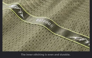 Detail of olive green breathable mesh lining with outdoor embroidery on the vest
