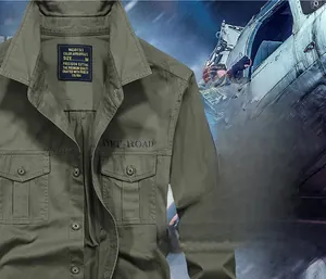 Detail of army green cotton work shirt featuring double chest pockets and metal buttons