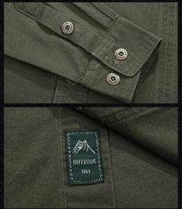 Close-up of military green cotton shirt featuring metal buttons and outdoor logo embroidery