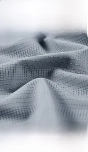 Close-up of grey ice silk fabric showing breathable micro-pore texture and soft knit