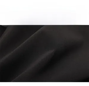 Close-up of premium black woven fabric texture on a casual men's jacket for autumn