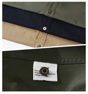 Close-up of retro metal buttons and cotton fabric texture on casual work shirts