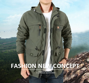 Detail of army green outdoor hooded jacket with multi-pocket system and chest print