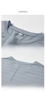 Detail view of grey quick-dry T-shirt featuring breathable mesh fabric and reflective strip