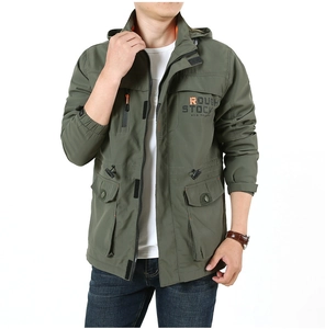 Detail of army green outdoor hooded jacket featuring Rough Stock print and utility pockets