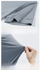 Detail of grey men's sports t-shirt showing breathable mesh fabric and high elasticity