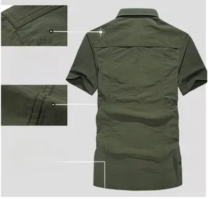 Detailed view of the shoulder stitching and back panel on a military green outdoor shirt