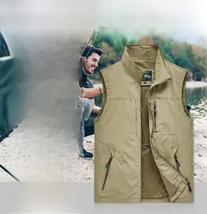 Detail of khaki outdoor vest showing multiple zipper pockets and breathable mesh lining